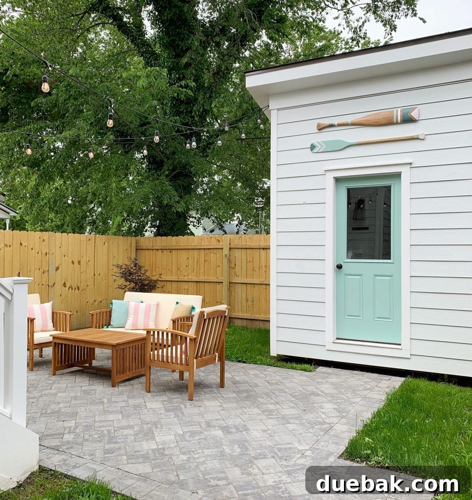 Coastal porch with blue door and hanging lanterns