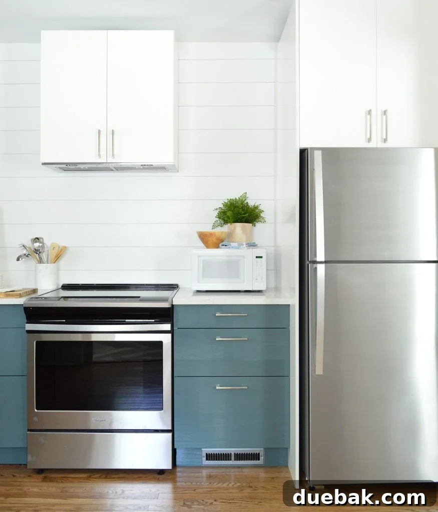 White Planked Wall Shiplap With Blue Ikea Cabinets