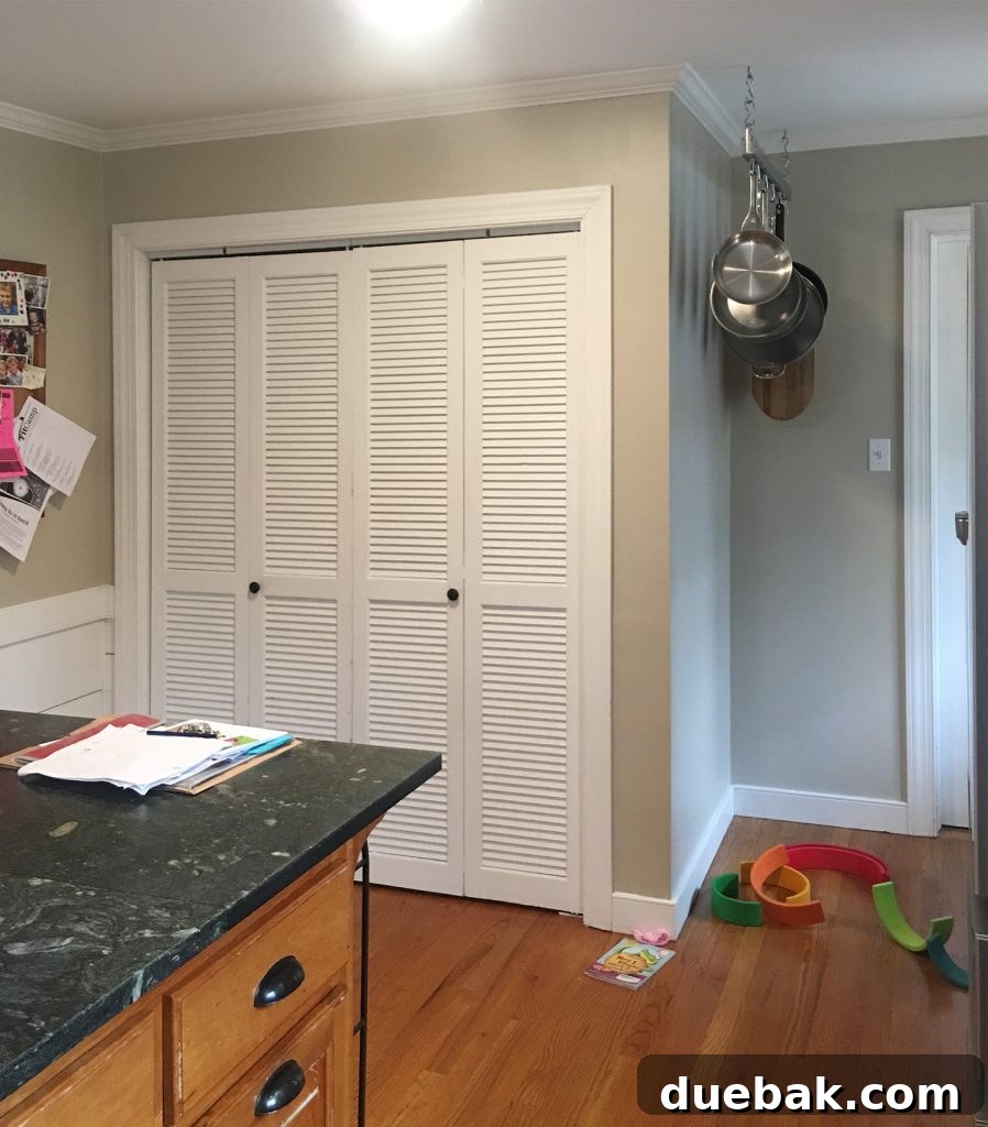 Elevate Your Kitchen Inset Doors for a Custom Cabinet Makeover 13 Before Photo Of Laundry Area In Kitchen With Bi Fold Doors