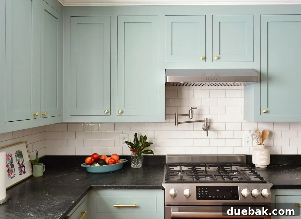 Elevate Your Kitchen Inset Doors for a Custom Cabinet Makeover 3 Halcyon Green Blue Kitchen Wall Cabinets With Gold Brass Knobs Above Stove