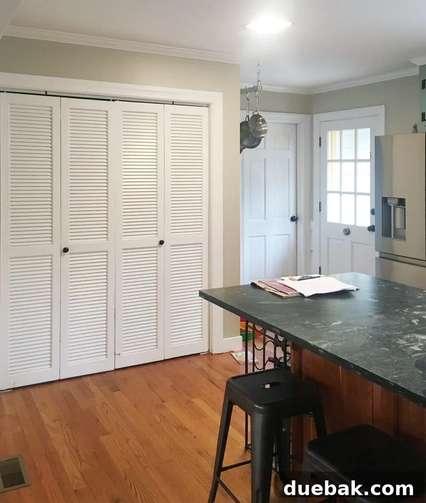 Elevate Your Kitchen Inset Doors for a Custom Cabinet Makeover 8 Before Photo Of Laundry Area In Kitchen With Bi Fold Doors And Island