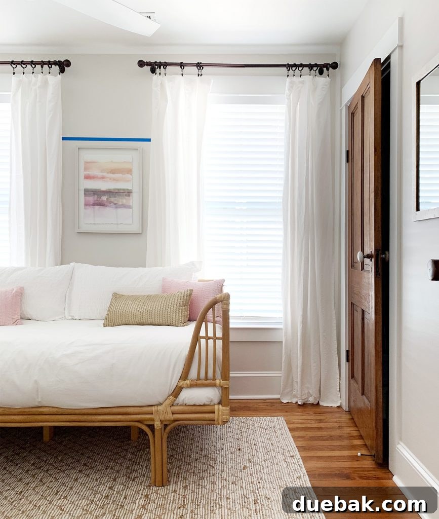 4 Smart Decor Hacks for an Effortless Home Transformation 3 Transformed beach house middle bedroom with a stylish daybed from the doorway