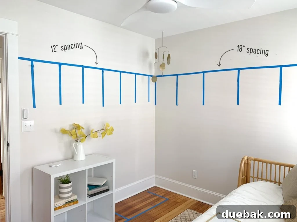 4 Smart Decor Hacks for an Effortless Home Transformation 9 Painter's tape mapping out board and batten wall treatment with two spacing options