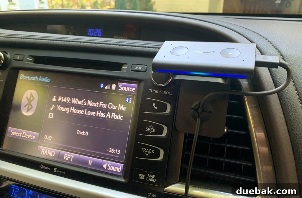 The Amazon Echo Auto device providing smart assistance in a car's interior, showing hands-free convenience