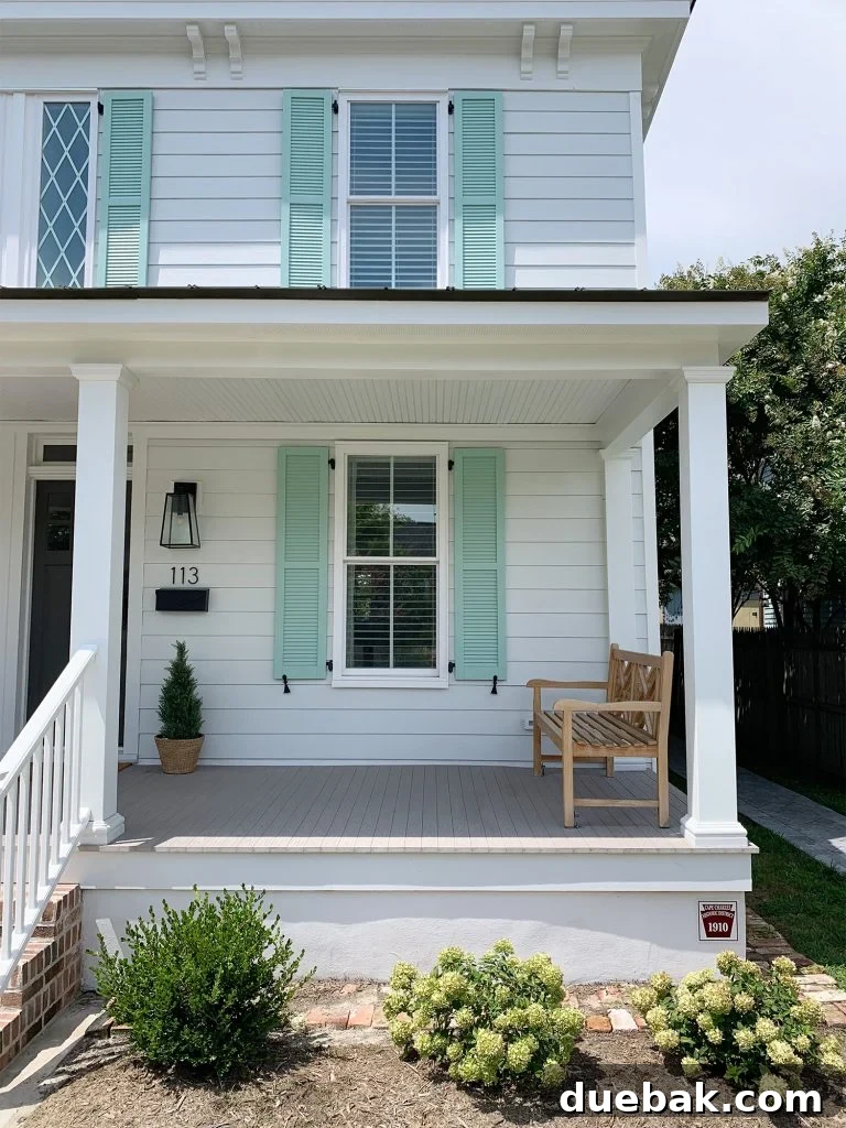 A charming duplex featuring elegant exterior shutters, serving as inspiration for home renovation