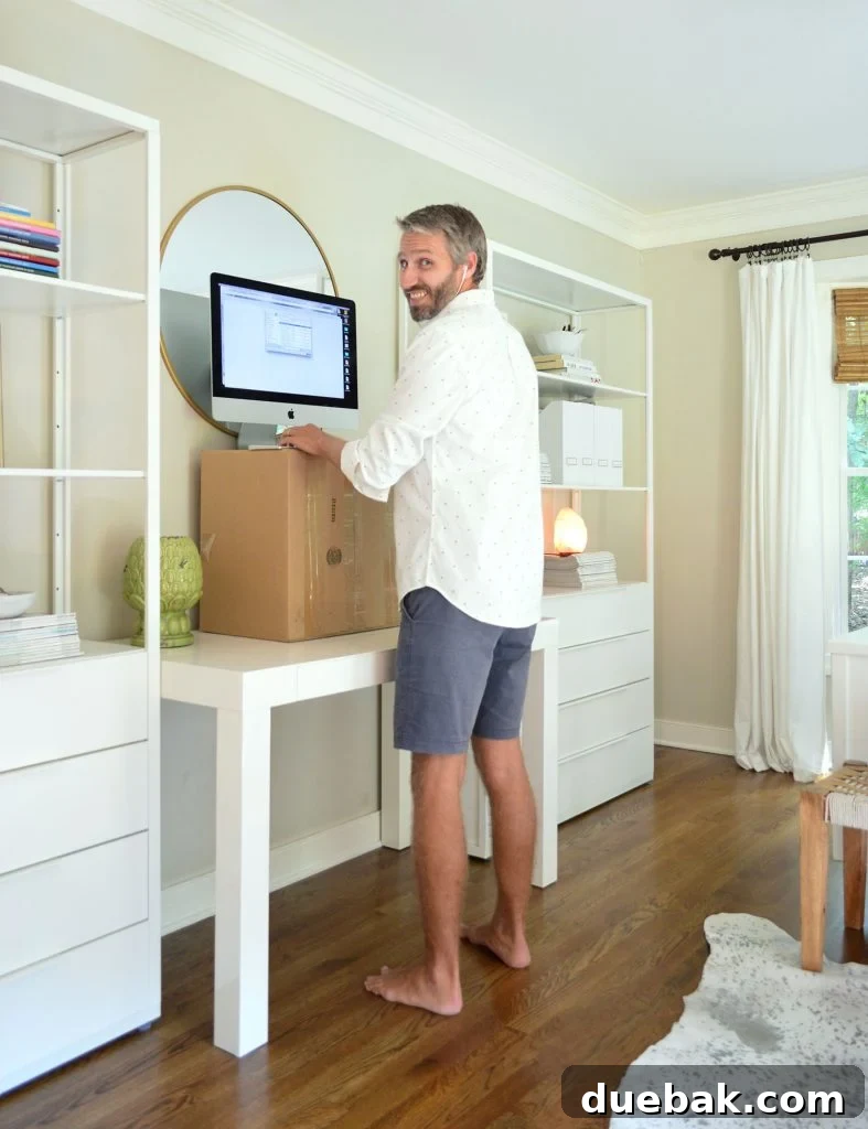 A makeshift standing desk created during a furniture-free week challenge, demonstrating creative solutions for living with less