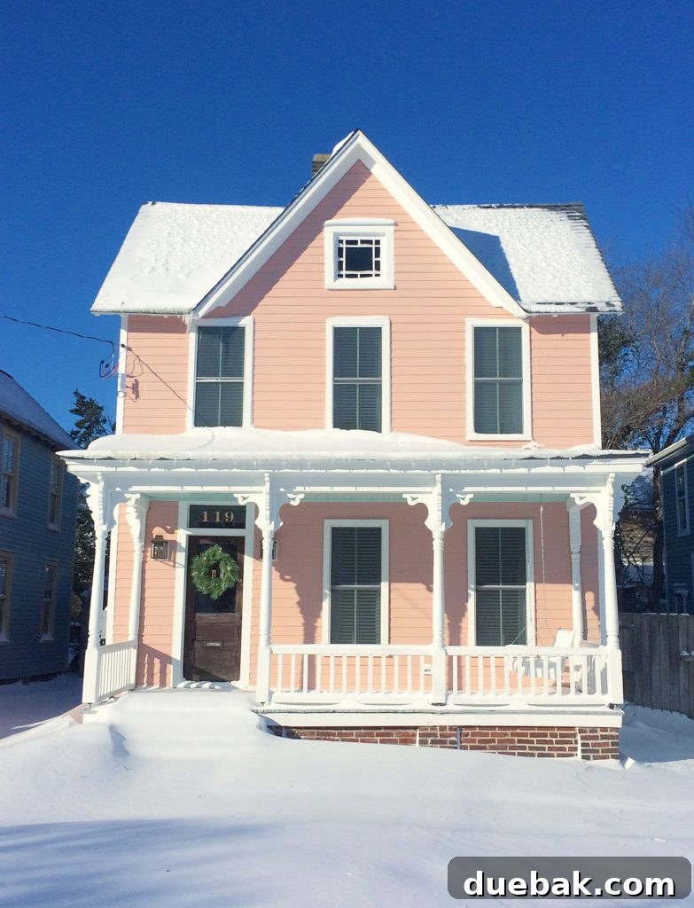 5 Heat-Free Ways To Prevent Frozen Pipes 5 Snow covered historic pink beach house, illustrating a property vulnerable to freezing