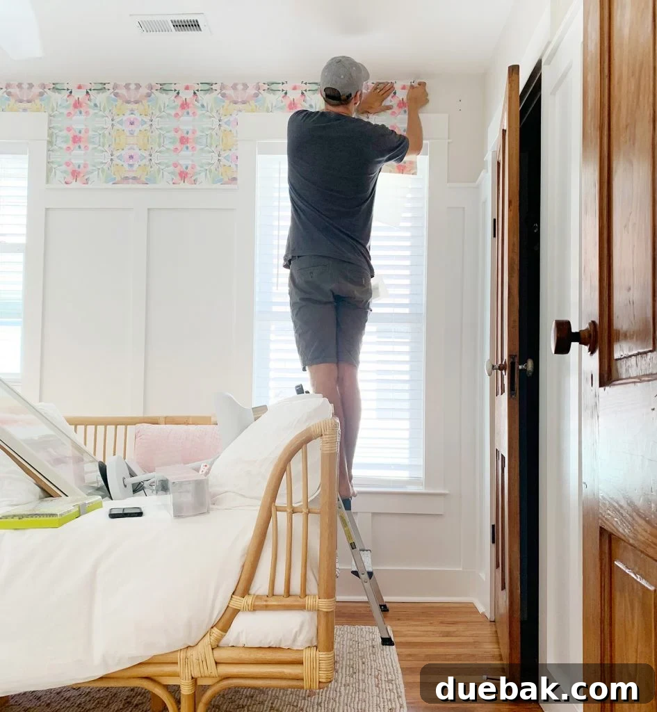 Effortlessly Install Peel and Stick Wallpaper 12 John Sticking Sheet Of Peel And Stick Wallpaper Above Window