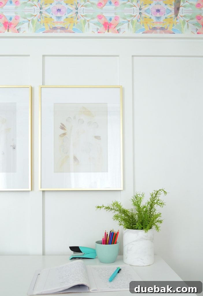 Textural Tides: Wallpaper and Board and Batten in a Beach Bedroom 13 Desk with gold frames hung on board and batten wall