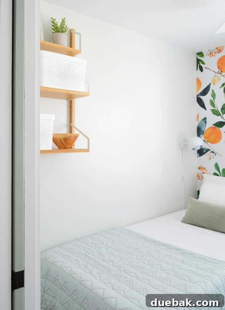 A wooden pocket door, partially open, revealing a glimpse of a creatively designed interior space.