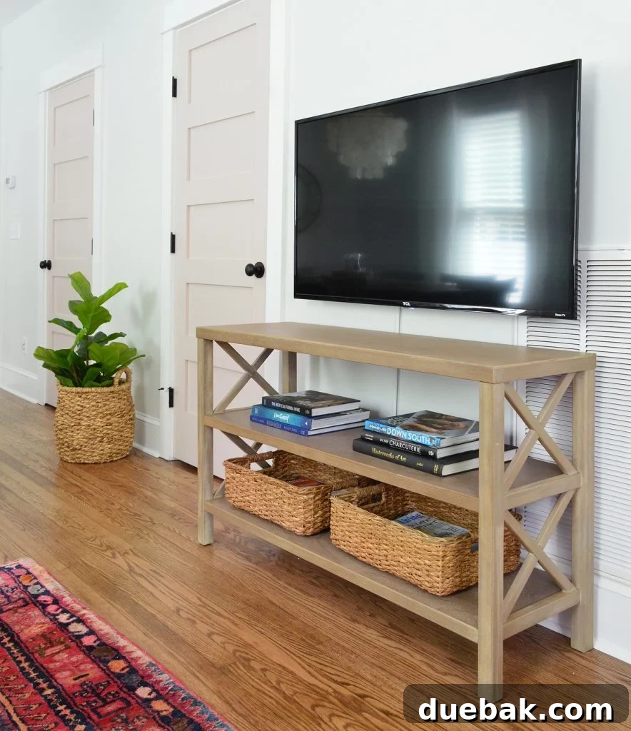 Target X Base Bookcase As Media Cabinet With Floating TV, showcasing a well-equipped entertainment area for guests