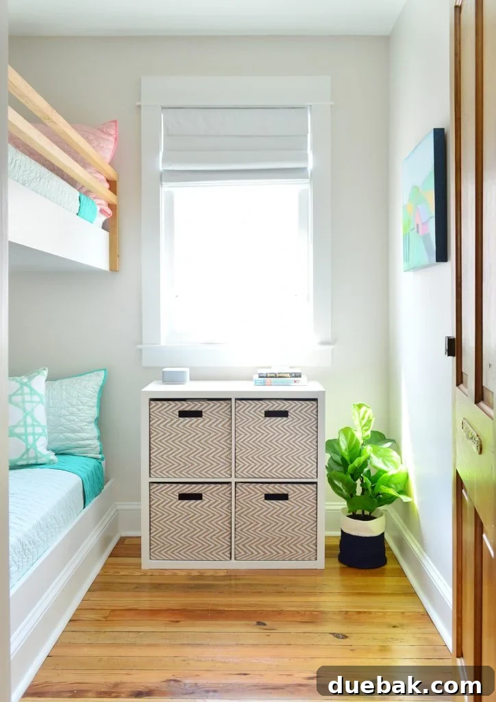 7 Beach House Renovations and the Story Behind Each Space 12 Cozy bunk room with a 4-cube organizer for kids' clothes