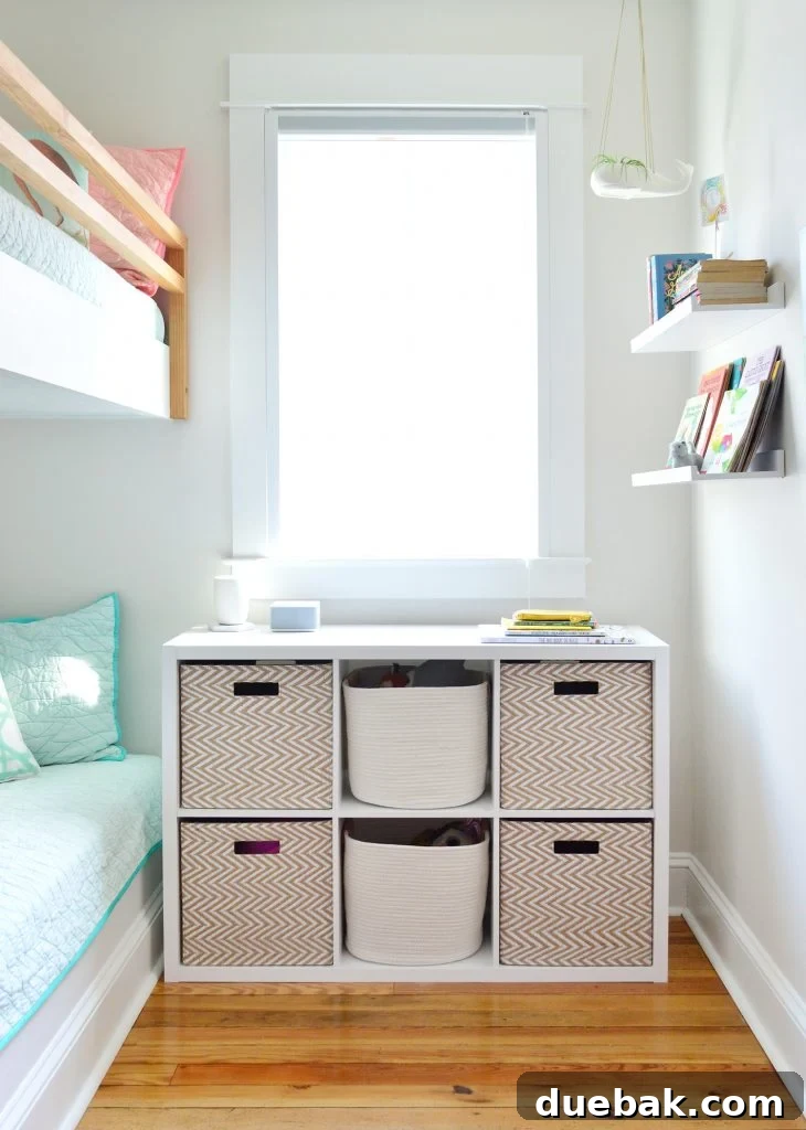 7 Beach House Renovations and the Story Behind Each Space 13 Kids' beach house bunk room featuring a new 6-cube organizer shelf with rope baskets for toy storage