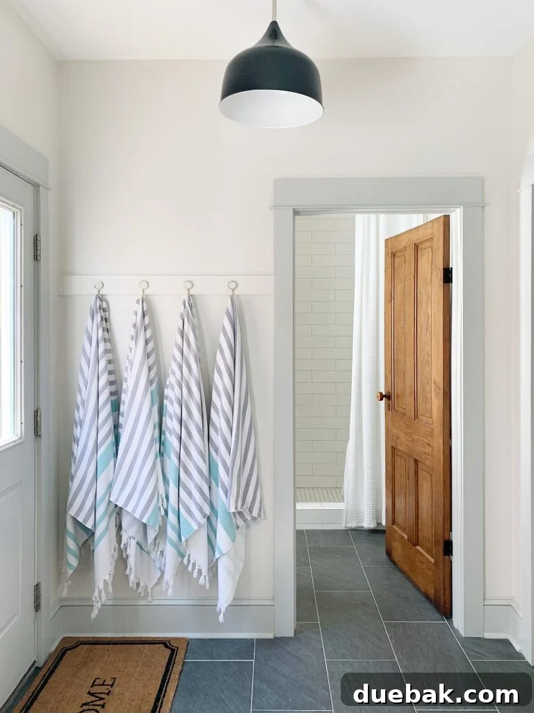 7 Beach House Renovations and the Story Behind Each Space 17 Mudroom with newly installed hook rail and additional storage, showcasing increased functionality