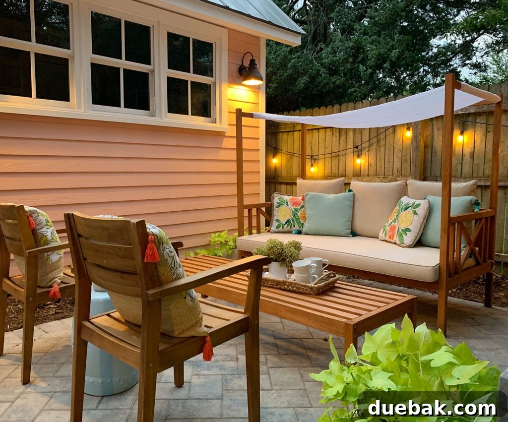 7 Beach House Renovations and the Story Behind Each Space 23 New patio layout featuring a conversation area and daybed bench used as a coffee table for outdoor games