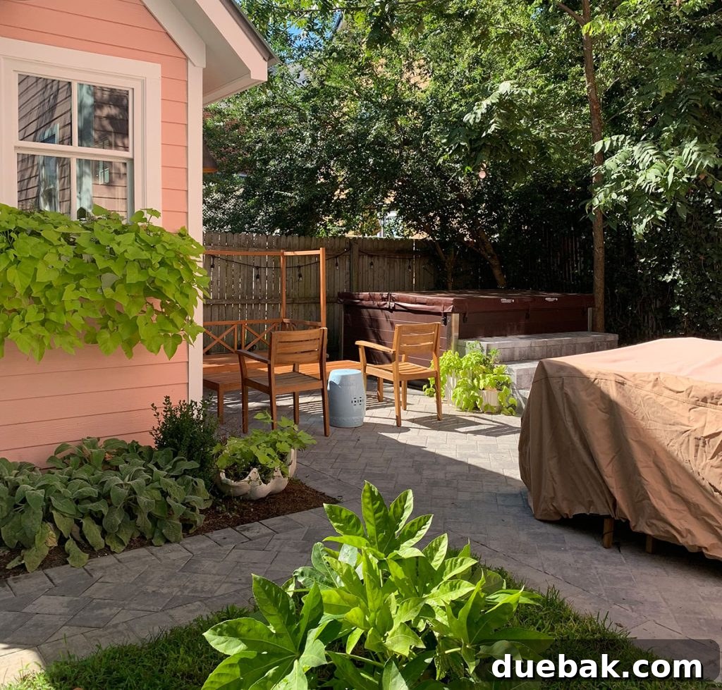 7 Beach House Renovations and the Story Behind Each Space 24 Beach house backyard winterized with furniture covered for the off-season