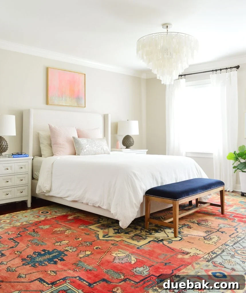 A beautifully designed bedroom featuring an upholstered bed in a neutral 'Talc' color, enhancing the room's elegant and clean aesthetic.