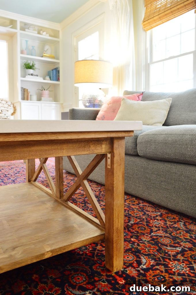 Brew Your Own Coffee Table 14 A detailed view of the satin brass corner brackets installed on the coffee table, providing extra stability and a decorative touch.