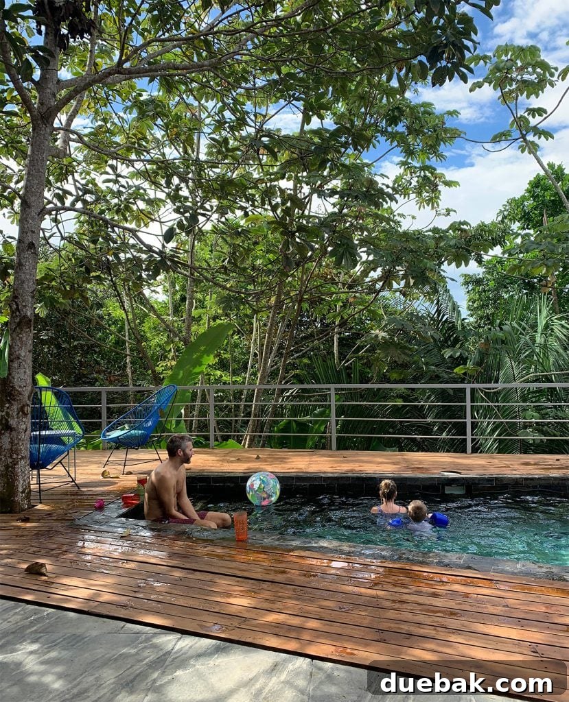 Wild Wonders: Costa Rica Family Fun 12 Dad Playing With Kids At Pool In Costa Rica Jungle