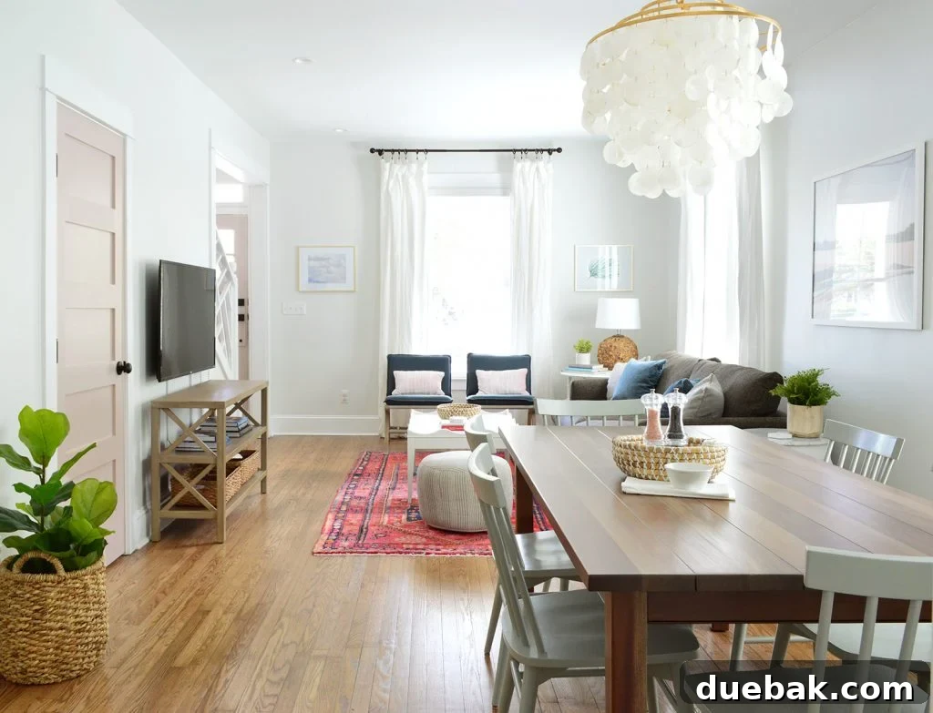 Major Duplex Updates 6 View from Duplex Kitchen with Dining Table and Capiz Chandelier, an inviting and bright space.