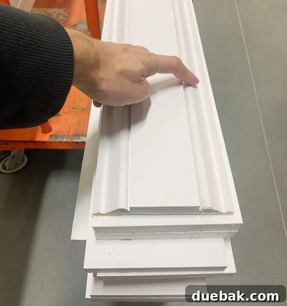 Elevate Your Walls with Decorative Molding 3 Decorative Wall Molding Trim Arranged On Shopping Cart for DIY Home Improvement