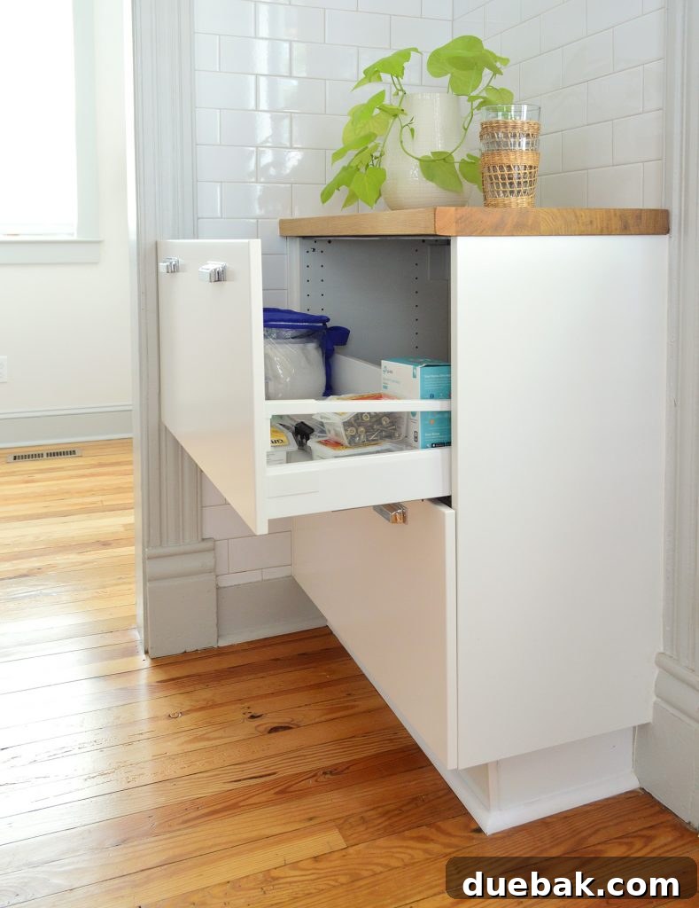 Kitchen cabinet drawer next to a doorway, showing full functionality