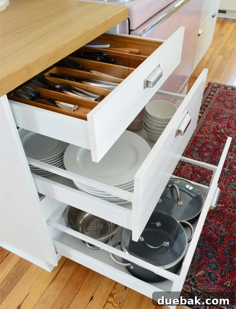 Kitchen drawer with neatly organized plates and bowls