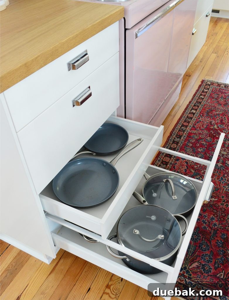 Kitchen drawer with a hidden internal drawer for organizing pots and pans