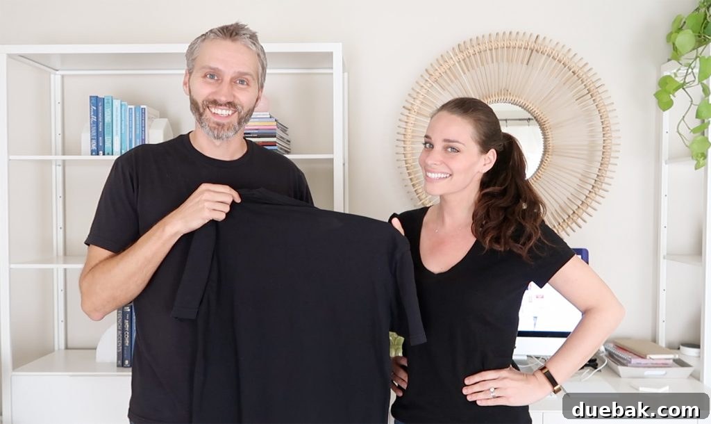 Two people wearing different shades of black t-shirts, showcasing the new collection.