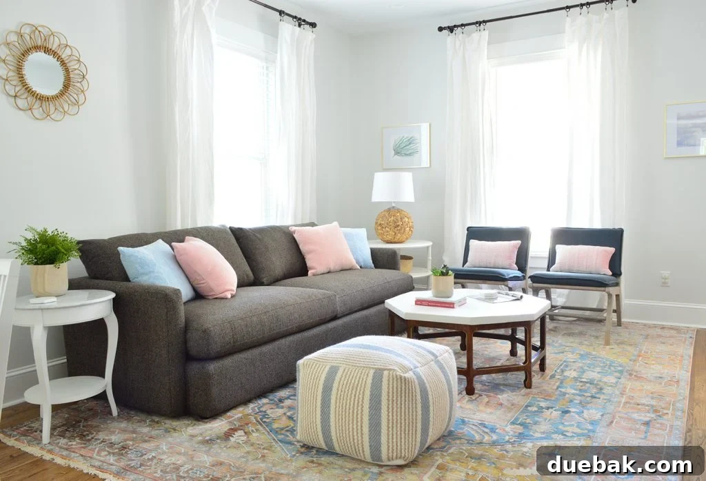 Revitalize Your Rug with a Pressure Washer 10 Duplex living room with neutral traditional rug, Crate and Barrel sofa