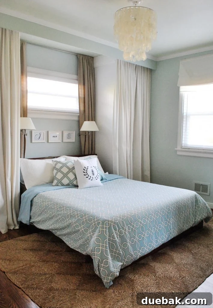 Our Petite Beach House: Maximizing Coastal Charm 3 A cozy corner of a living space featuring a large, decorative clam shell bowl on a coffee table, surrounded by subtle beach-themed decor.