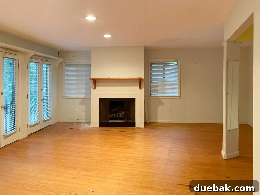 Fireplace wall in the future master bedroom, before renovation.