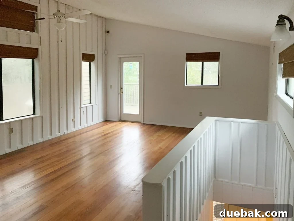 Upstairs flex space, a large, bright room with potential for various uses.