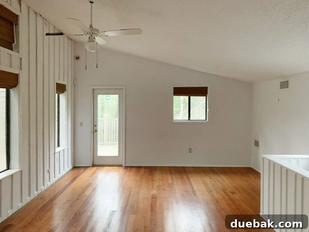 Another view of the upstairs flex space, highlighting its size and natural light.
