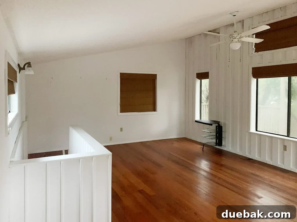 Other side of the upstairs flex space, showcasing its large footprint.