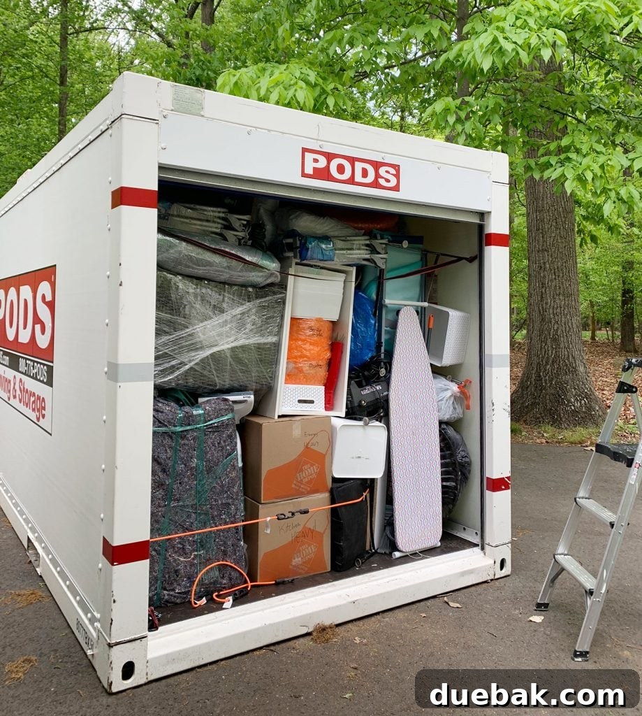 Our New Home Checklist: What We're Tackling and What We're Skipping 3 A tightly packed PODS container with various household items.