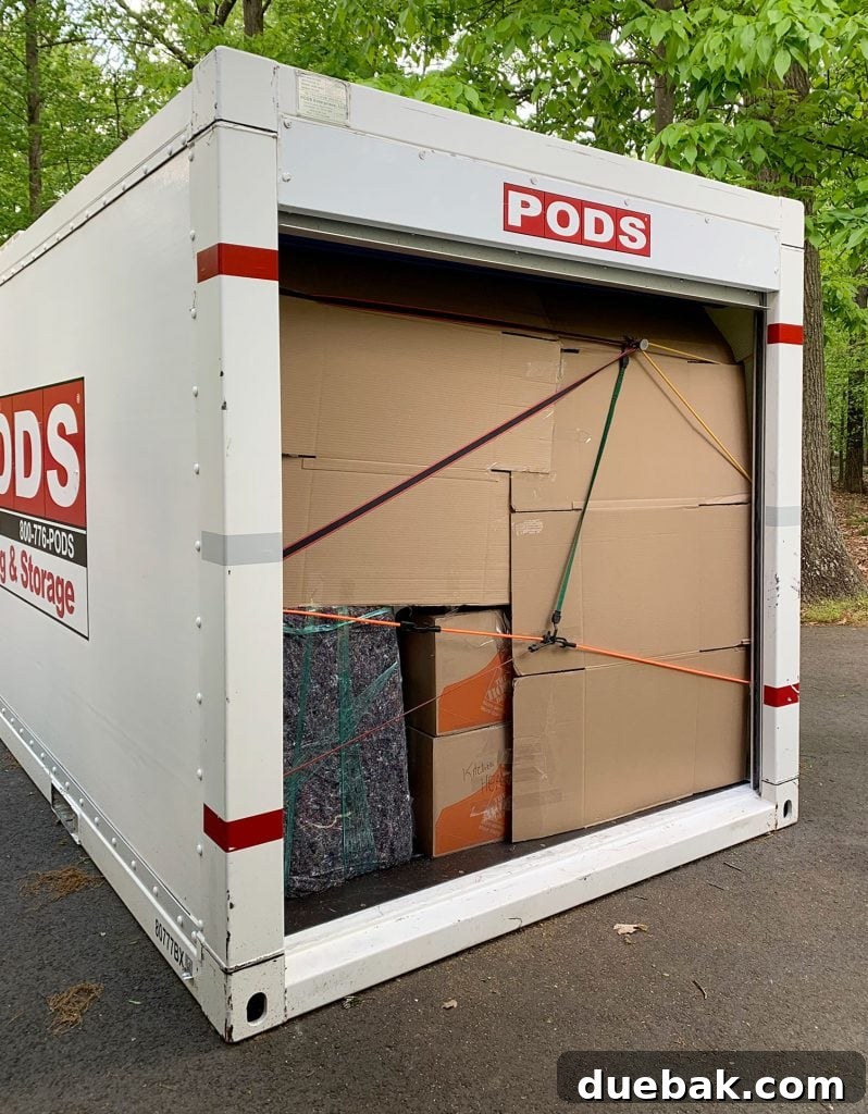 Our New Home Checklist: What We're Tackling and What We're Skipping 4 A makeshift cardboard barrier inside a PODS container to prevent items from shifting.