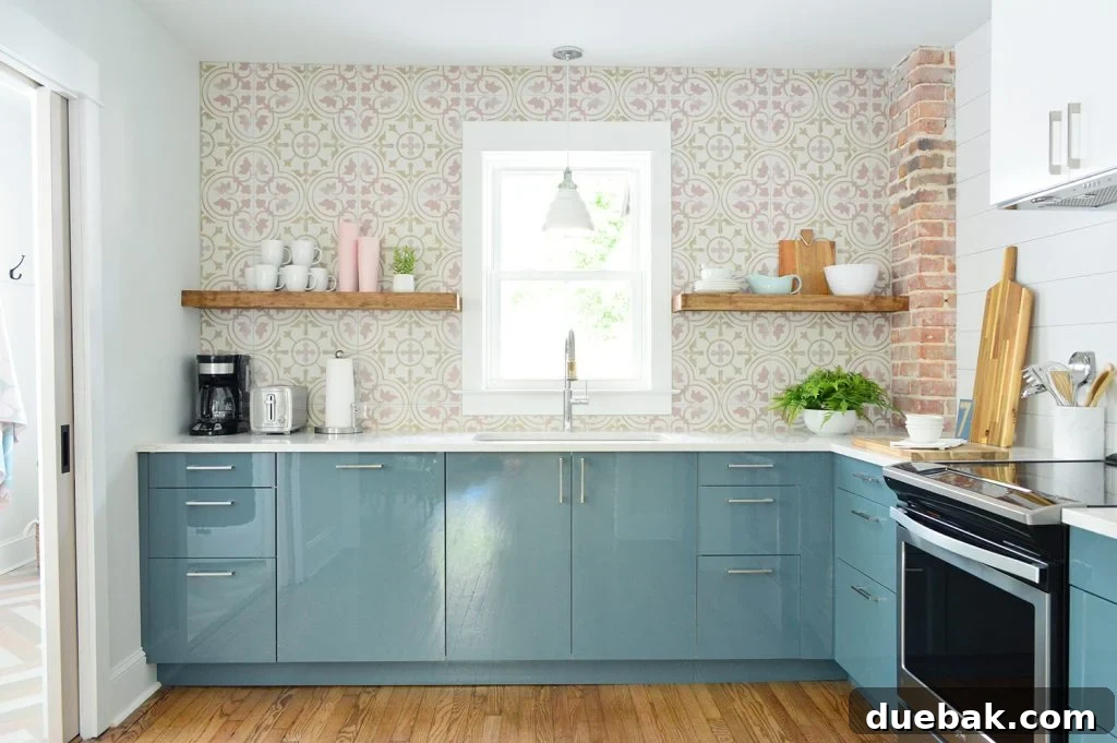 Our New Home Checklist: What We're Tackling and What We're Skipping 6 Duplex kitchen with vibrant blue cabinets and a playful pink patterned backsplash.
