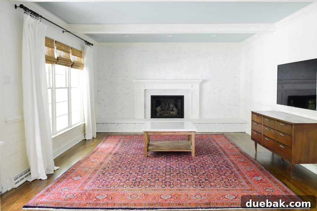 Empty living room revealing hardwood floors and a spacious layout in the Richmond home, post-moving preparations.