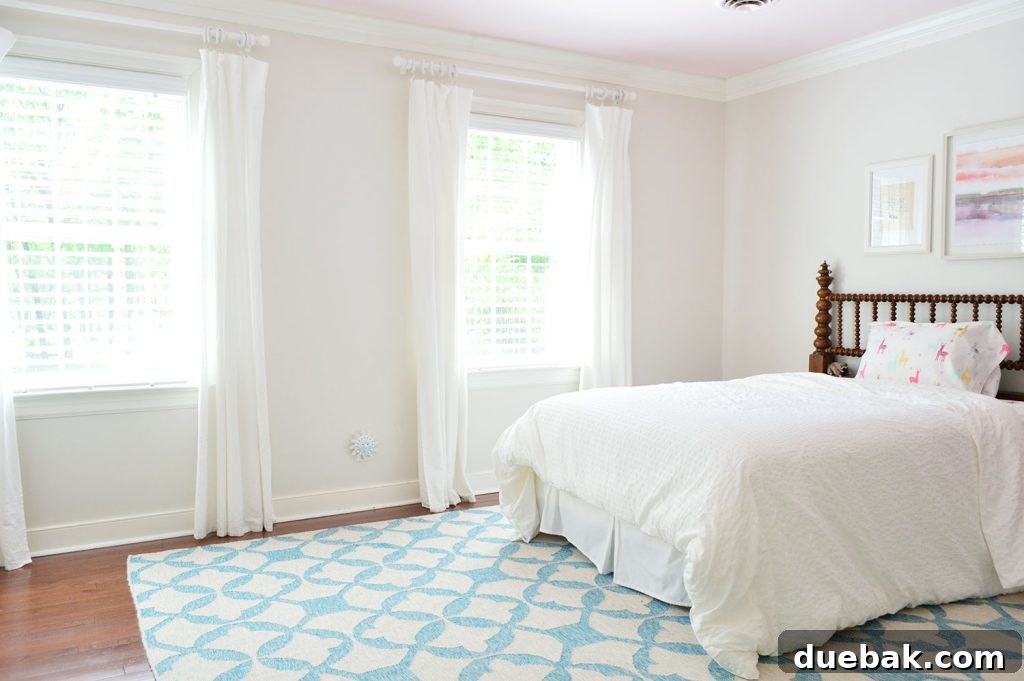 Empty girl's bedroom, cleared out and ready for new furniture and decor, reflecting the downsizing process in the Richmond home.