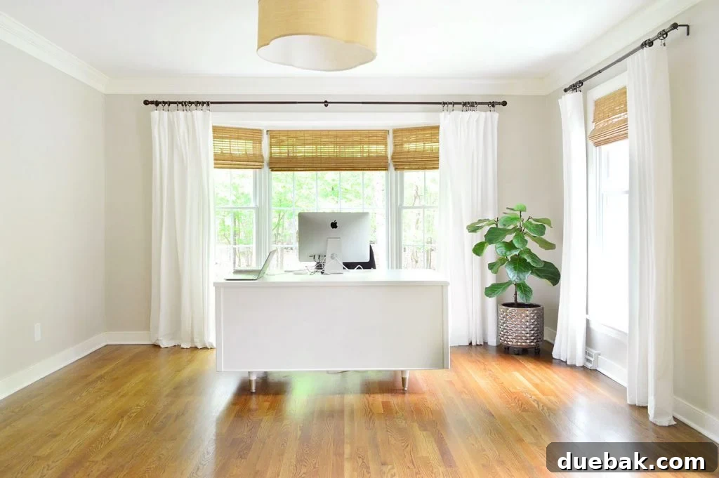 Curtain rod with ball finials re-attached, providing a comparison to the finial-free look.