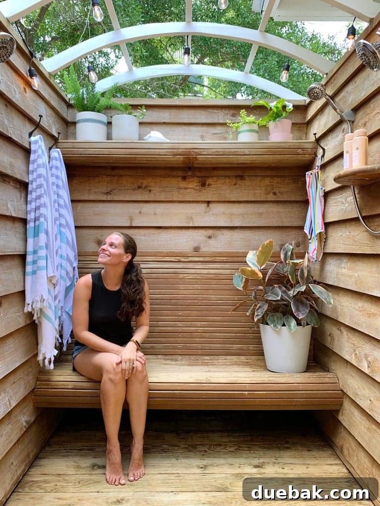 Outdoor shower with bench, showing potential area for a future doorway to a pool.