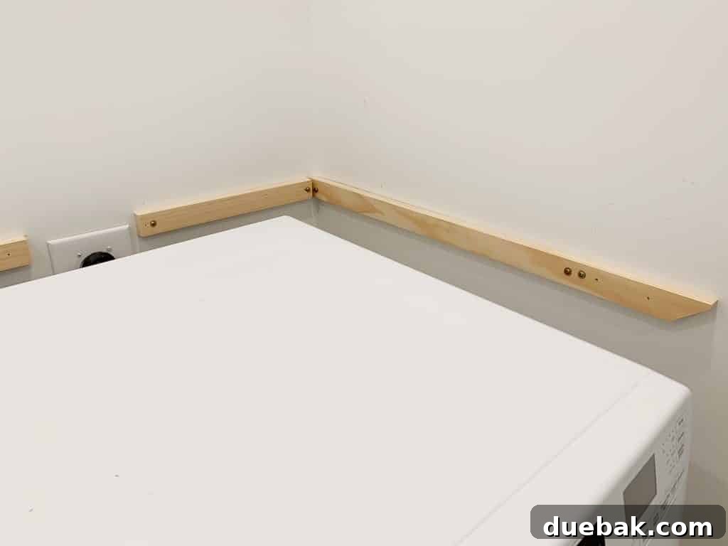 Side view of wall support for DIY laundry shelves
