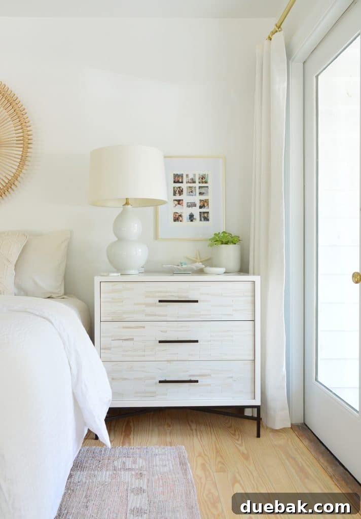 Bedroom Refresh: What's New and What's Next 13 Side of primary bedroom with double doors, nightstand, and decor, showing potential future ensuite area