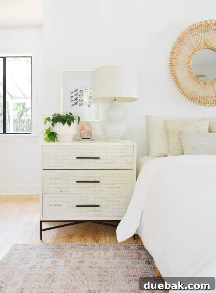 Bedroom Refresh: What's New and What's Next 14 Nightstand dresser with gold frame and lamp, showcasing intricate wood-tiled details