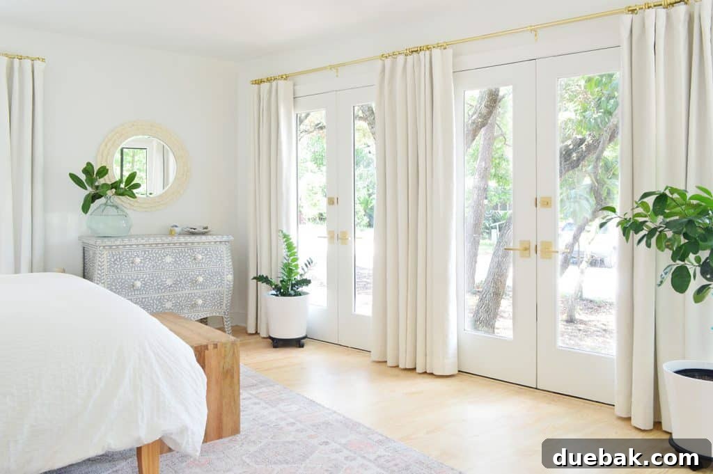 Bedroom Refresh: What's New and What's Next 8 View of the primary bedroom with elegant ivory blackout curtains drawn, highlighting the bed and rug