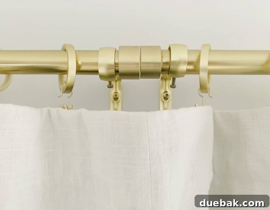 Bedroom Refresh: What's New and What's Next 10 Close-up showing the junction of three curtain rods seamlessly joined to create a long track