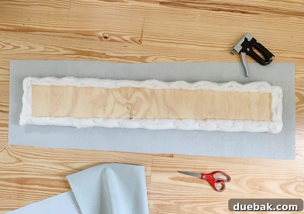 Craft Your Own Channel Tufted Headboard 13 An upholstered channel panel, demonstrating the neat fabric application.