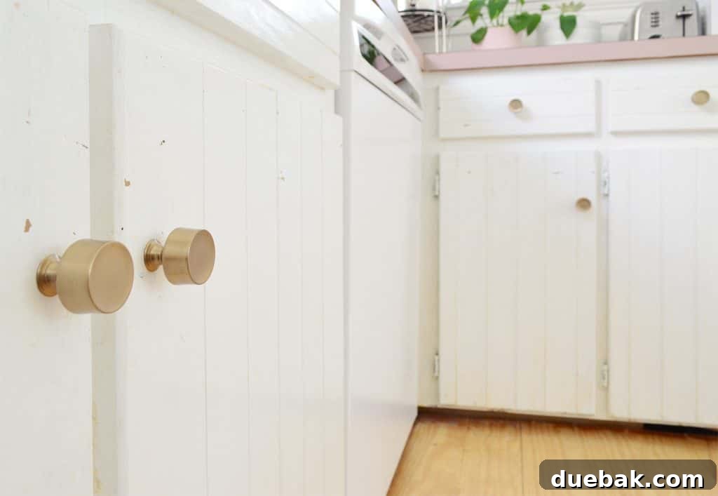 5 Speedy Kitchen Makeovers 16 After Photo Of Gold Brass Knobs Replaced On White Kitchen Cabinets