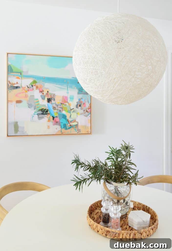 5 Speedy Kitchen Makeovers 9 Close Up Of Woven White Pendant Light From Pottery Barn Teen Over Table With Beachy Art